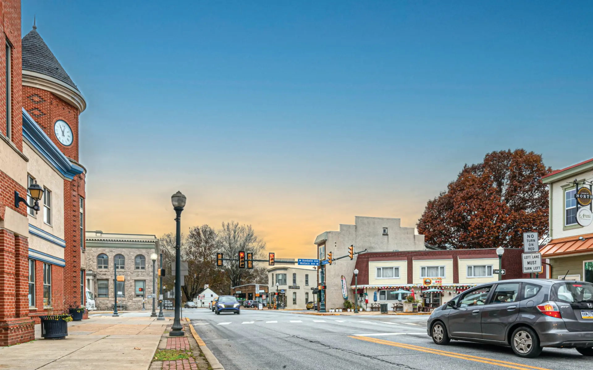 Downtown Downingtown streetscape with brick buildings and a clock tower in Chester County PA